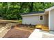 Backyard with fresh landscaping features mulch accents and a dry riverbed with stone at 122 W Union St, Hillsborough, NC 27278
