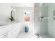 Modern bathroom with glass-enclosed shower and double sink vanity at 122 W Union St, Hillsborough, NC 27278