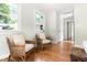 Inviting bedroom features a cozy sitting area and large windows at 122 W Union St, Hillsborough, NC 27278