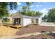 Charming cottage featuring a deck with table and chairs, new landscaping, and neutral siding at 122 W Union St, Hillsborough, NC 27278