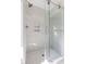 Modern shower with glass enclosure and tile accents at 122 W Union St, Hillsborough, NC 27278