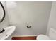 Powder room features wood floors, vessel sink, and toilet at 12316 Amoretto Way, Raleigh, NC 27613