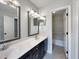 Bathroom features double sinks and modern fixtures with an adjacent bathtub at 12316 Amoretto Way, Raleigh, NC 27613