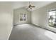Bedroom features high ceilings, neutral carpet, and bright windows at 12316 Amoretto Way, Raleigh, NC 27613