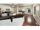 Modern kitchen with white cabinets, dark countertops, butcher block island, and updated appliances at 12316 Amoretto Way, Raleigh, NC 27613