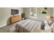 Bright bedroom features a large window, stylish furniture, and neutral decor for a cozy, modern feel at 12316 Amoretto Way, Raleigh, NC 27613