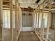 New bathroom shows bathtub with fiberglass insulation and wood frame at 129 Grace Pond Ave, Benson, NC 27504