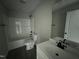 A bathroom with shower and tub at 129 Grace Pond Ave, Benson, NC 27504