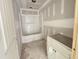 Bathroom is in the construction phase, featuring white cabinet and covered bathtub at 129 Grace Pond Ave, Benson, NC 27504