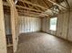 Spacious new bedroom with fiberglass insulation and natural light from window at 129 Grace Pond Ave, Benson, NC 27504
