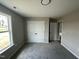 Neutral bedroom with closet and natural light at 129 Grace Pond Ave, Benson, NC 27504