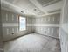 Spacious bedroom featuring a large window and modern ceiling design during the construction phase at 129 Grace Pond Ave, Benson, NC 27504