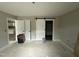 Spacious bedroom with a sliding barn door, offering plenty of room at 129 Grace Pond Ave, Benson, NC 27504