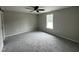 Cozy bedroom with plush carpeting and a bright window at 129 Grace Pond Ave, Benson, NC 27504