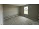 Unfinished bedroom featuring a window that allows natural light, enhancing the spacious feel at 129 Grace Pond Ave, Benson, NC 27504