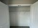 A closet with neutral paint and carpet at 129 Grace Pond Ave, Benson, NC 27504