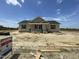 Charming, new construction single-Gathering home featuring neutral siding and a classic roofline at 129 Grace Pond Ave, Benson, NC 27504