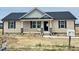 Charming single-story home featuring a covered porch and newly installed siding, walkway, and mailbox at 129 Grace Pond Ave, Benson, NC 27504