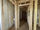 Hallway view of wood frame with fiberglass insulation at 129 Grace Pond Ave, Benson, NC 27504