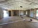 Interior view of a new home under construction, revealing exposed framing and insulation at 129 Grace Pond Ave, Benson, NC 27504