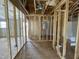 Interior view of a new home under construction, revealing exposed framing and electrical at 129 Grace Pond Ave, Benson, NC 27504