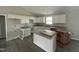 Bright kitchen with white cabinets, granite countertops, and a center island at 129 Grace Pond Ave, Benson, NC 27504