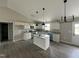 Modern kitchen with stainless steel appliances, granite countertops, and center island at 129 Grace Pond Ave, Benson, NC 27504