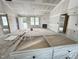 Open-concept living room features a fireplace, recessed lighting, and a doorway view into the kitchen area at 129 Grace Pond Ave, Benson, NC 27504