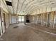 New living room with natural light from window and fiberglass insulation at 129 Grace Pond Ave, Benson, NC 27504