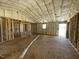 A spacious living room with fiberglass insulation and wood framing at 129 Grace Pond Ave, Benson, NC 27504