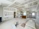 Open-concept living room features high ceilings and a doorway view into the kitchen with white cabinets at 129 Grace Pond Ave, Benson, NC 27504