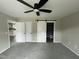 Spacious main bedroom featuring a sliding barn door to the ensuite bathroom at 129 Grace Pond Ave, Benson, NC 27504