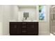 Bathroom with a dual sink vanity and a large mirror providing ample space at 1300 Hazelnut Ridge Ln, Knightdale, NC 27545