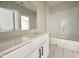 Bathroom features a white stone vanity with a view of a shower/bathtub combination at 1309 Sanctuary Pond Dr, Raleigh, NC 27603