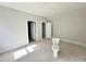 Bright bathroom area features an adjacent walk-in closet and new toilet installation at 1309 Sanctuary Pond Dr, Raleigh, NC 27603