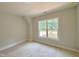 Bedroom with neutral walls, a window for natural light, and carpeted floors at 1309 Sanctuary Pond Dr, Raleigh, NC 27603