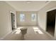 Bright room with sunlight streaming through the windows and a new toilet to be installed at 1309 Sanctuary Pond Dr, Raleigh, NC 27603