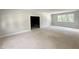 Spacious room with a large window provides ample natural light and airy feel at 1309 Sanctuary Pond Dr, Raleigh, NC 27603