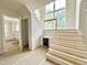 Staircase with unfinished wood steps and a built-in beverage cooler at 1309 Sanctuary Pond Dr, Raleigh, NC 27603