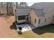 Aerial view of home featuring a screened porch, patio, and lush backyard at 150 Lystra Ridge Rd, Chapel Hill, NC 27517