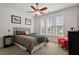 Bedroom with ceiling fan, comfortable bed, and a bright sunny window at 150 Lystra Ridge Rd, Chapel Hill, NC 27517