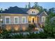 Handsome home combining stone with siding, complemented by attractive landscaping at 150 Lystra Ridge Rd, Chapel Hill, NC 27517