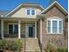 Stone accents, craftsman architecture, and a welcoming front porch highlight this beautiful home at 150 Lystra Ridge Rd, Chapel Hill, NC 27517