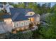 Captivating home with stone and siding, enhanced by the well-manicured green front yard at 150 Lystra Ridge Rd, Chapel Hill, NC 27517