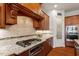 The kitchen boasts granite countertops, stainless steel appliances, and an adjacent pantry for ample storage at 150 Lystra Ridge Rd, Chapel Hill, NC 27517