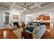 Bright living space featuring coffered ceilings, wood floors, fireplace and an open view to the kitchen at 150 Lystra Ridge Rd, Chapel Hill, NC 27517