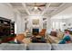 Comfortable living room with coffered ceilings, a cozy fireplace, wood floors and ample natural light at 150 Lystra Ridge Rd, Chapel Hill, NC 27517