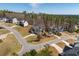 Street view showcasing home's placement within a well-kept neighborhood and tree-lined streets at 150 Lystra Ridge Rd, Chapel Hill, NC 27517