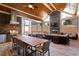 Inviting outdoor living space with a built-in grill, fireplace, and comfortable seating at 150 Lystra Ridge Rd, Chapel Hill, NC 27517