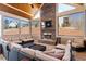 Relaxing sunroom featuring a stone fireplace, comfortable seating, and ample natural light at 150 Lystra Ridge Rd, Chapel Hill, NC 27517